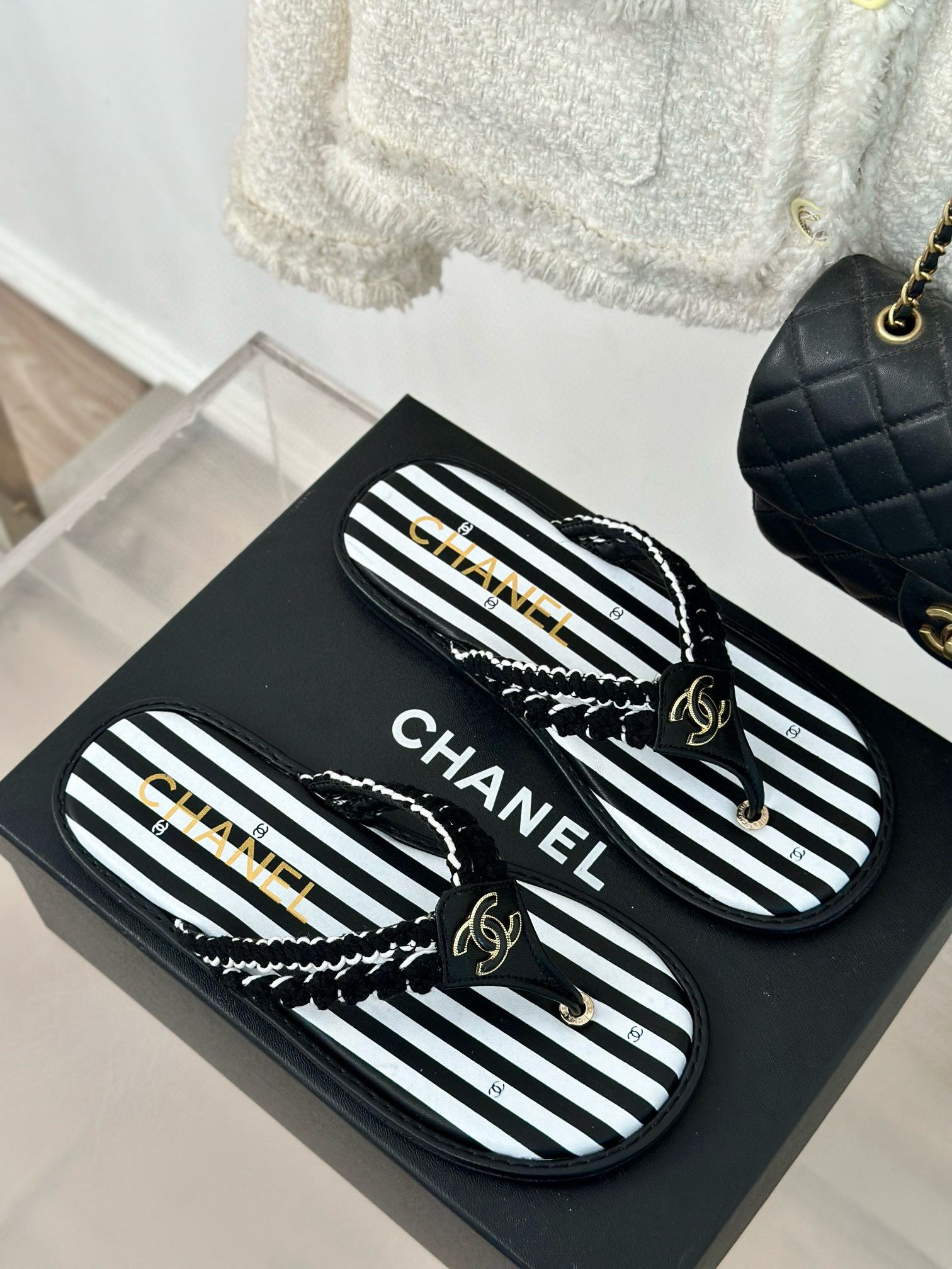 CHANEL Striped flip-flops