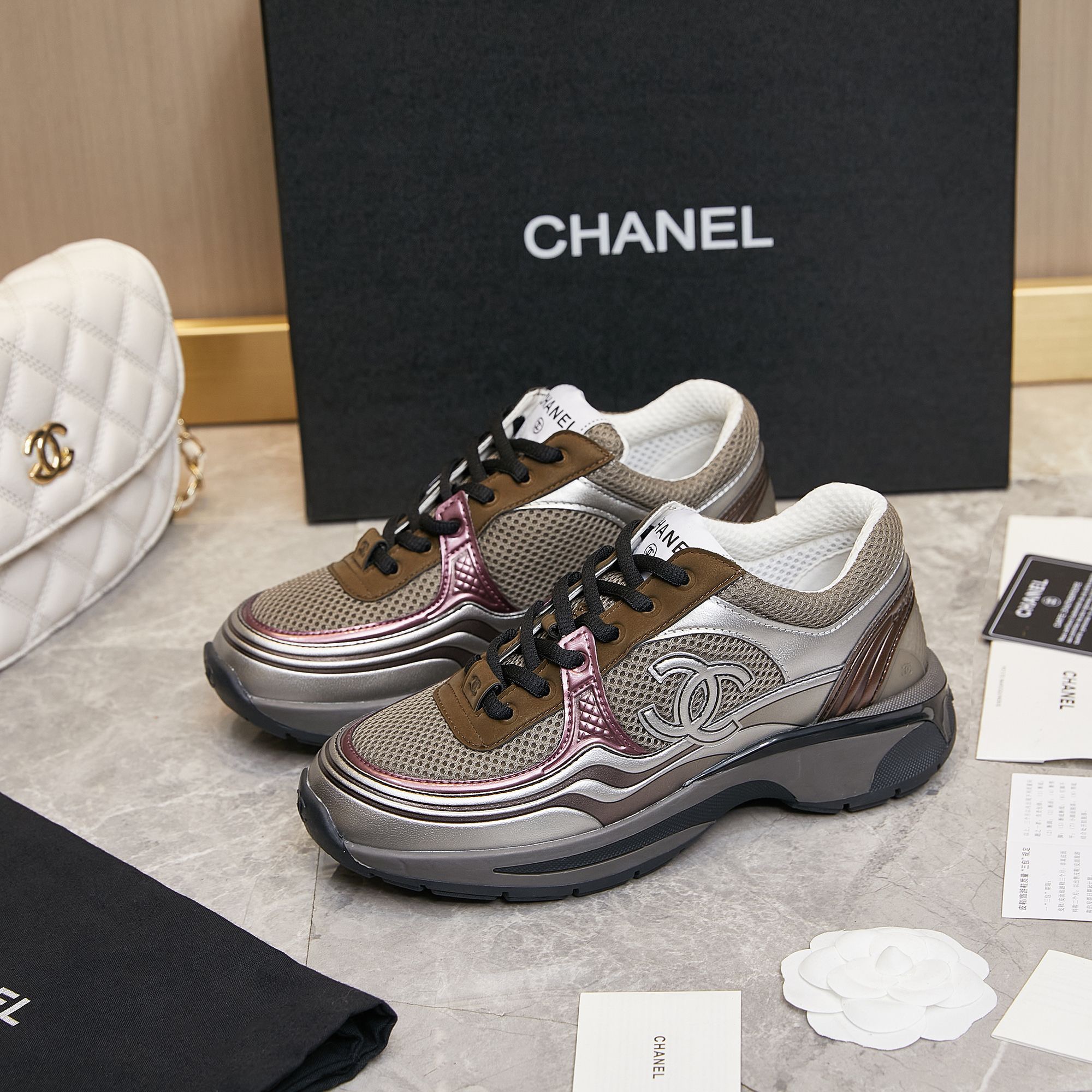 CHANEL Gold and silver horn king sneakers