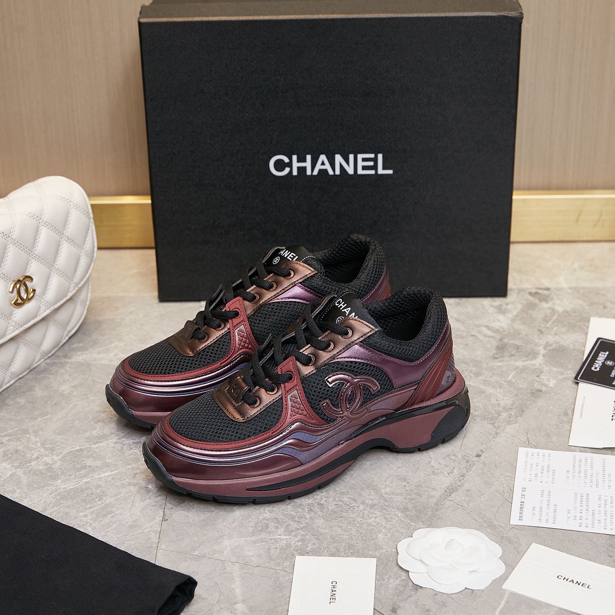CHANEL Gold and silver horn king sneakers
