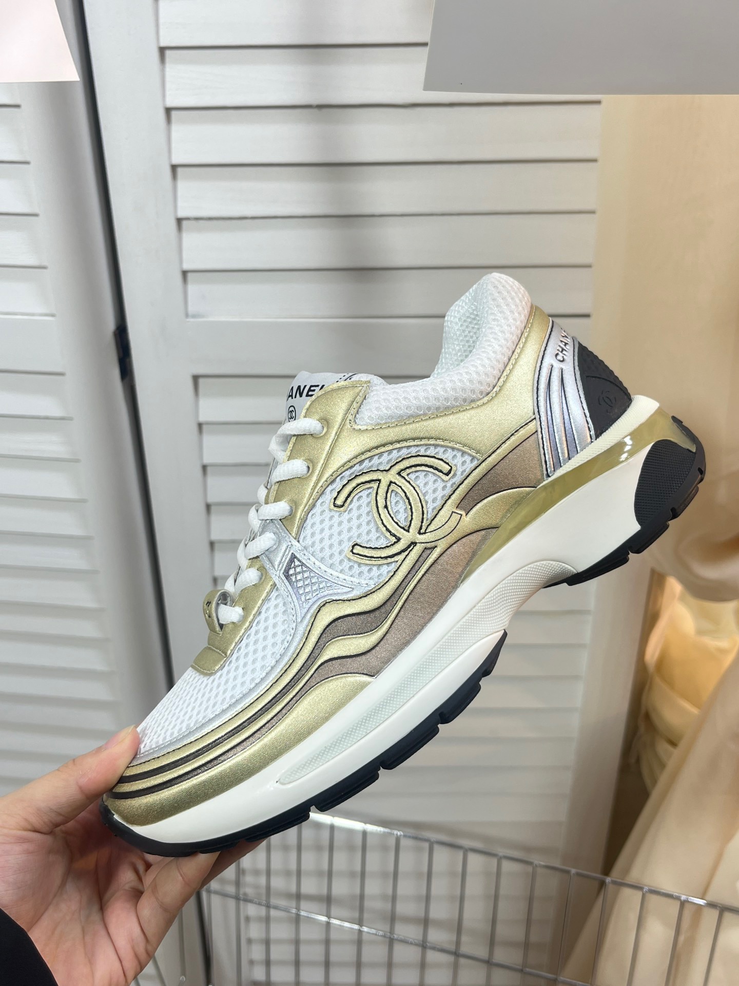 CHANEL Gold and silver horn king sneakers