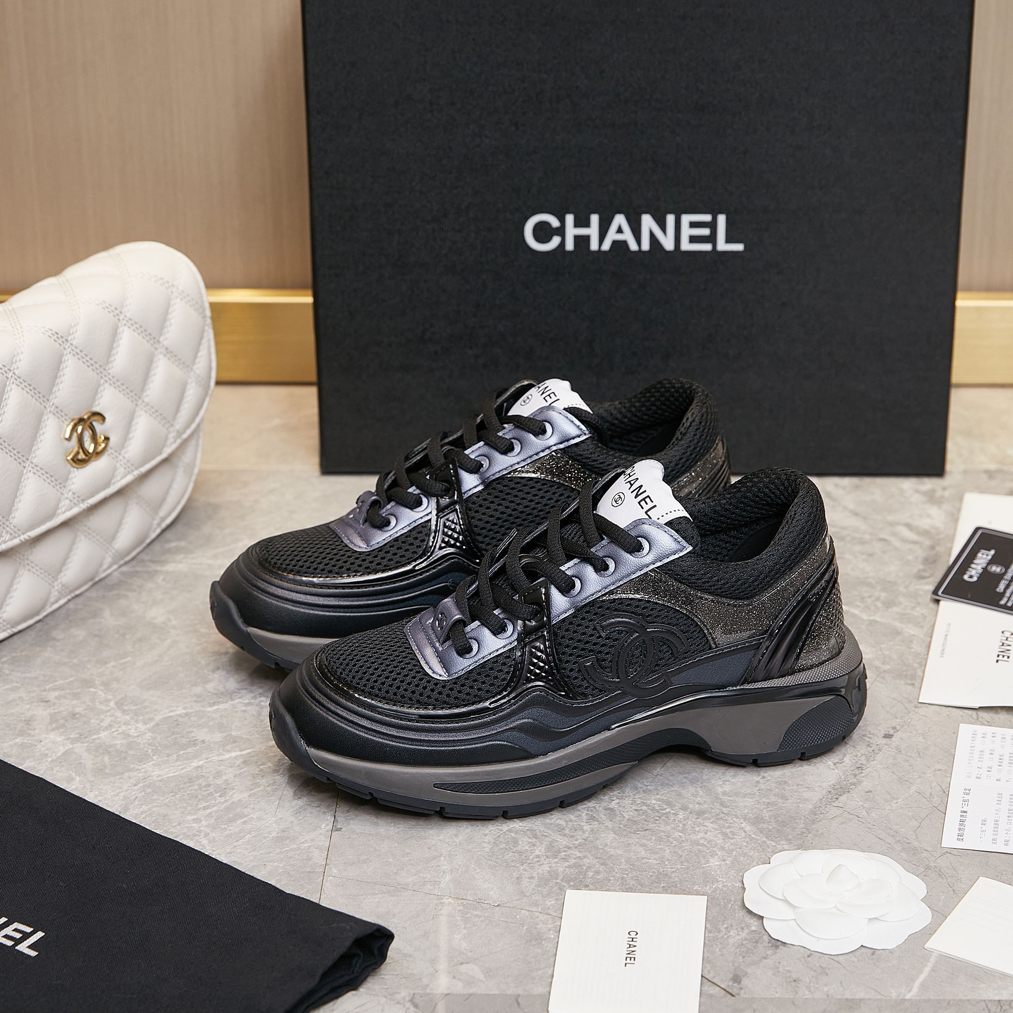 CHANEL Gold and silver horn king sneakers