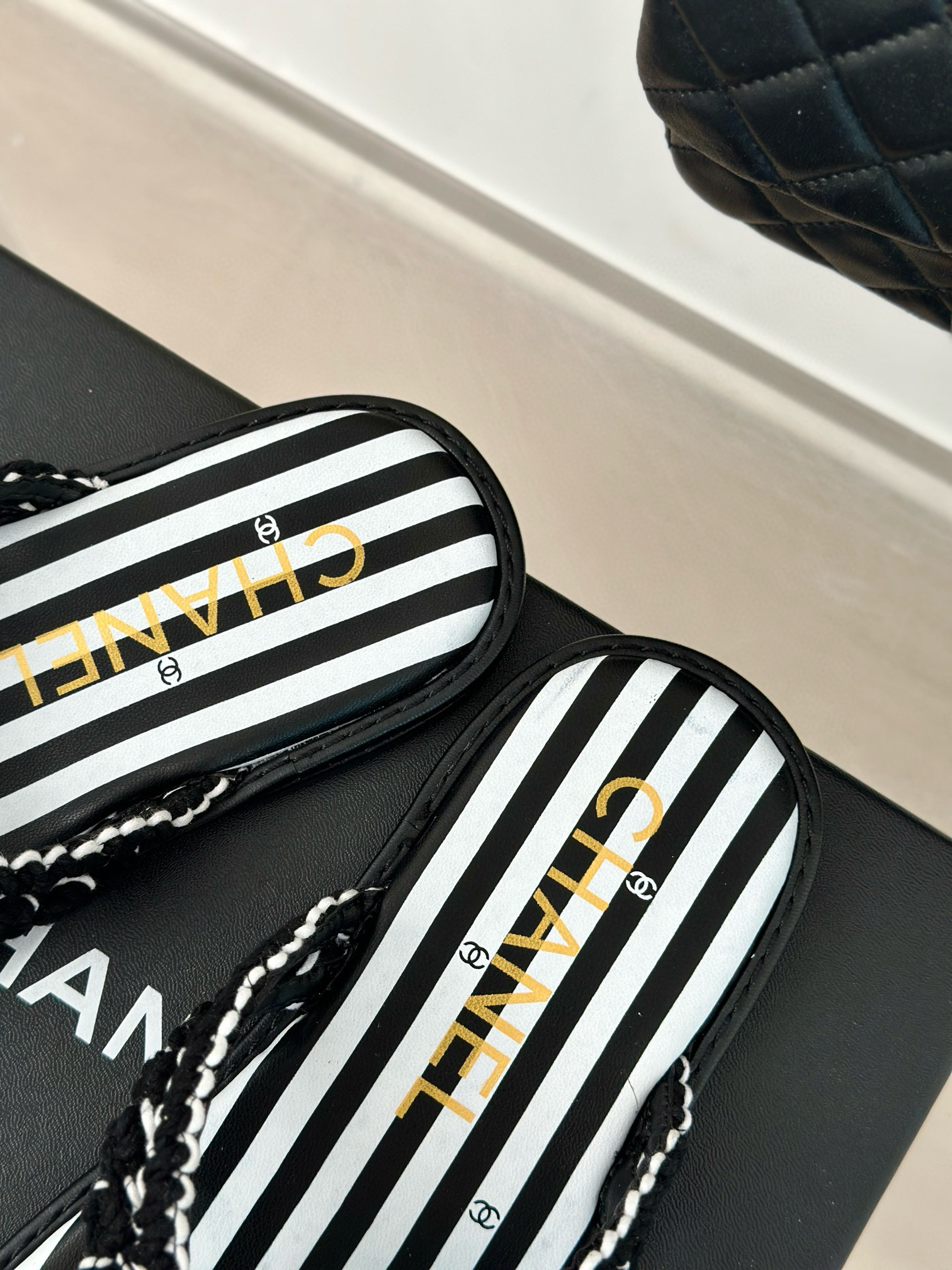 CHANEL Striped flip-flops